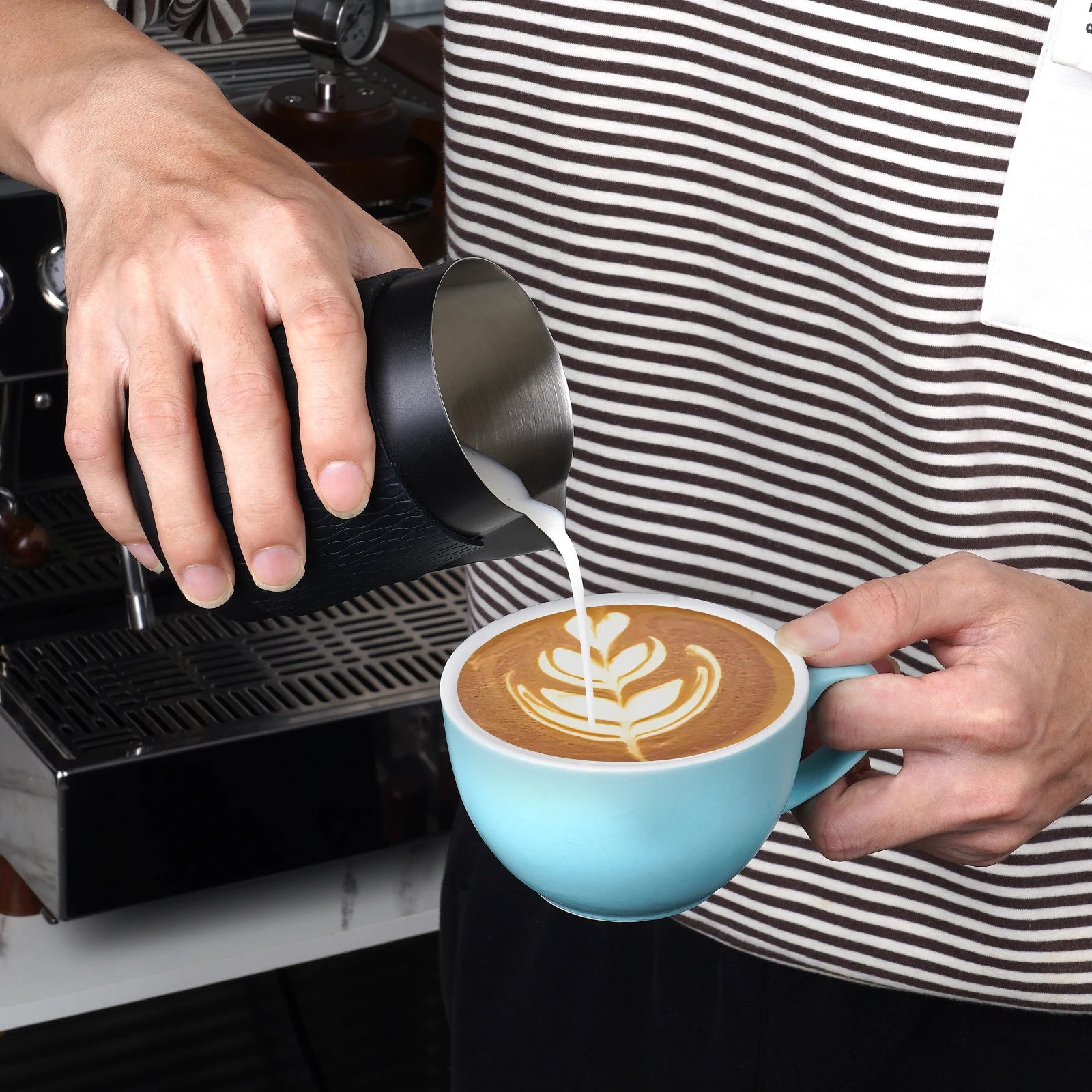 Pouring latte art for handleless coffee milk jug